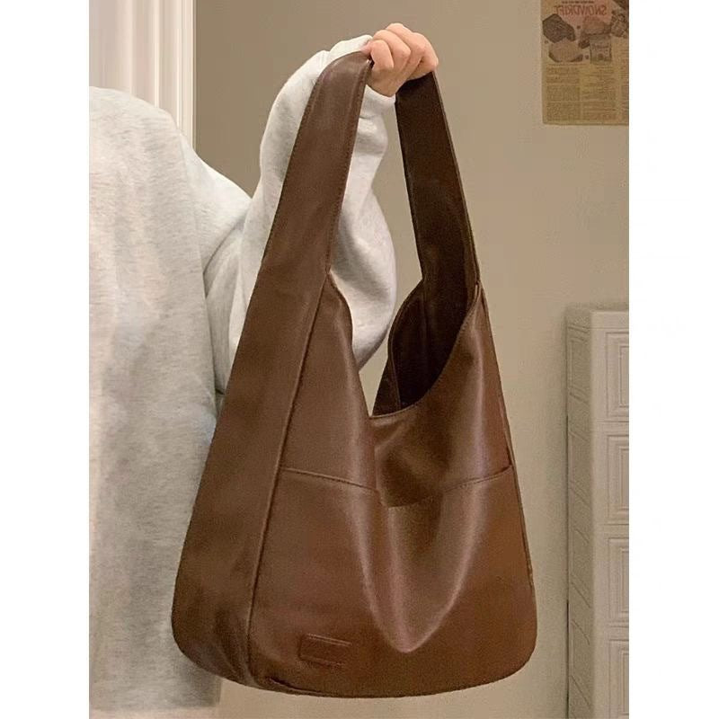 Soft leather tote bag Large capacity brown bucket bag Versatile commuting shoulder bag for women-AURA REGALIA 
